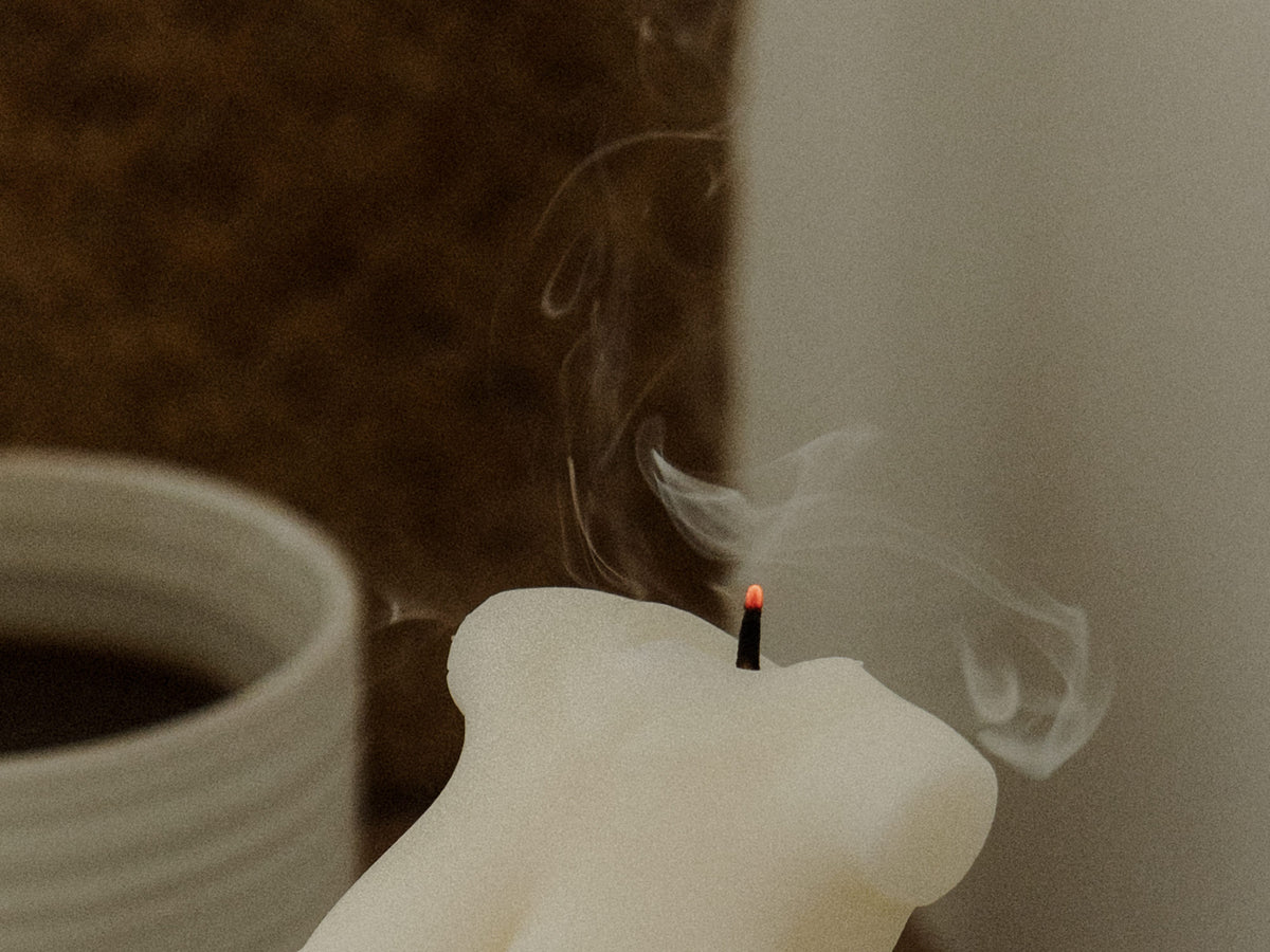 Incense smoke against warm light